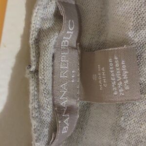 Long sleeve shirt with hood on it and the front has pockets size small